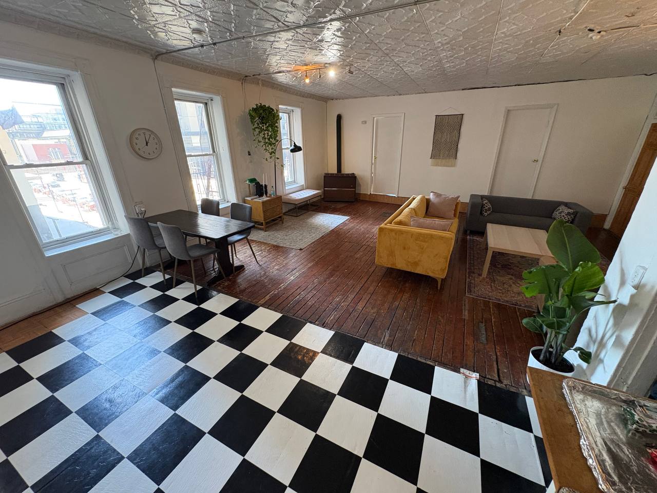 Loft with checkered floor and tin ceiling